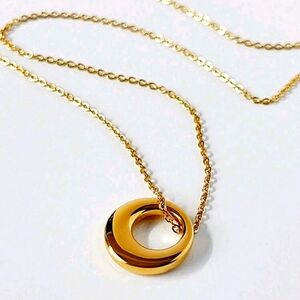 Old gold tone, plated donut pendant necklace